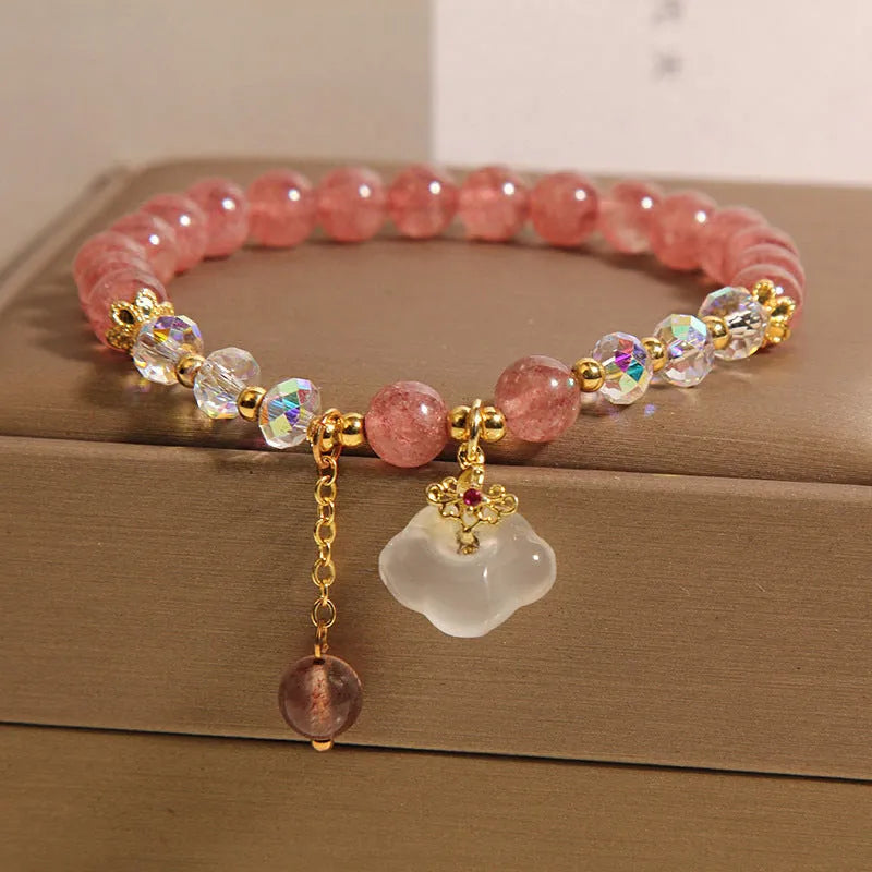 Women's adjustable crystal bracelet with strawberry quartz, white agate beads, and auspicious cloud charms