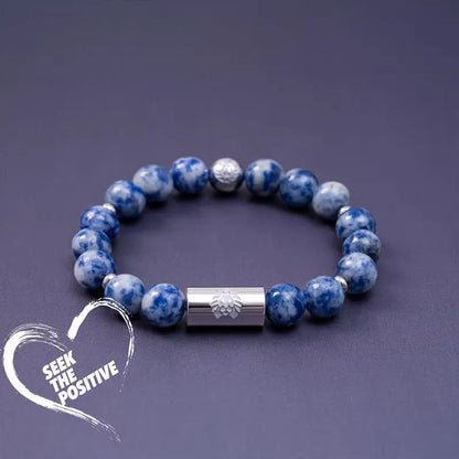 Black and white Qiankun bodhi seed ethnic bracelet with geometric shapes on wrist