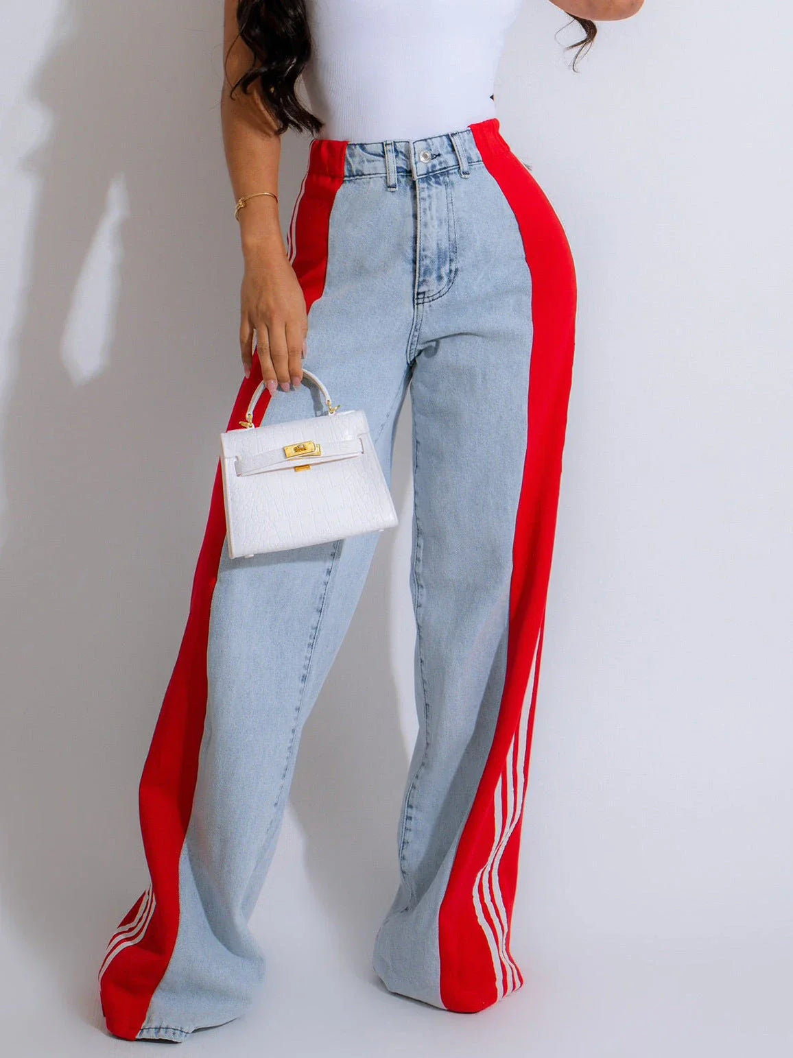 Stylish high-waist denim trousers with patchwork design, available in various color options