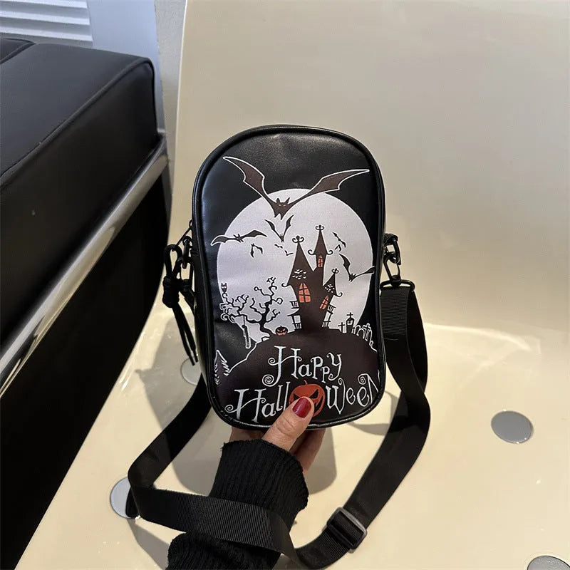 Halloween graffiti print crossbody bag in black with pumpkin, ghost, and bat designs, measuring 14x23x9.5cm