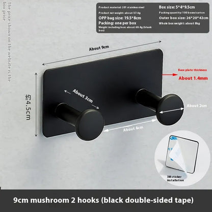 Screwless mushroom-style clothes hook with adhesive backing, shown in white on a tiled wall.