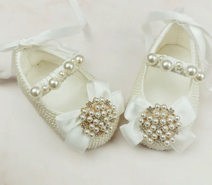 Handmade milky white cloth shoes with lace-up closure and matching fabric headband