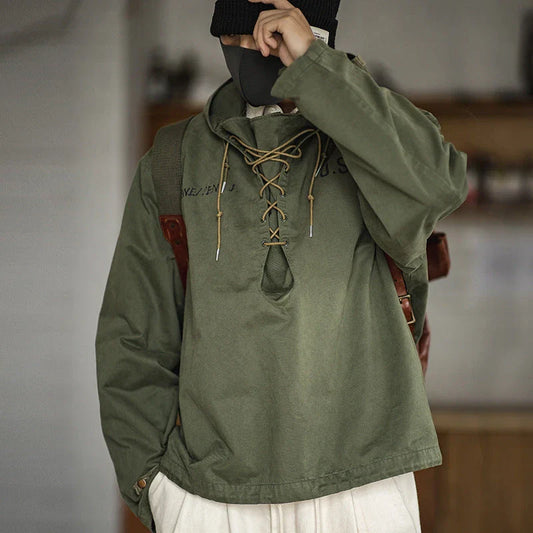 Rugged military-style hooded jacket for men made of durable cotton fabric with wind-resistant features and classic design