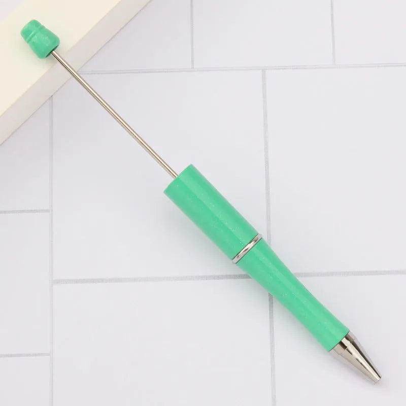 Rotating bead ballpoint pen in gradient colour with ABS plastic and steel wire construction