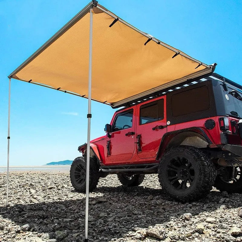 Black glue coated car sunshade tent with aluminium poles set up outdoors.