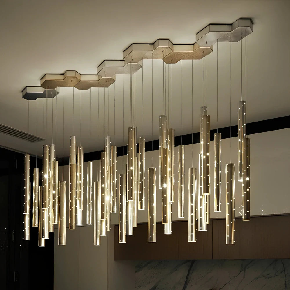 Carved hollow tube bar chandelier with six LED heads in aluminium alloy construction measuring 120cm length