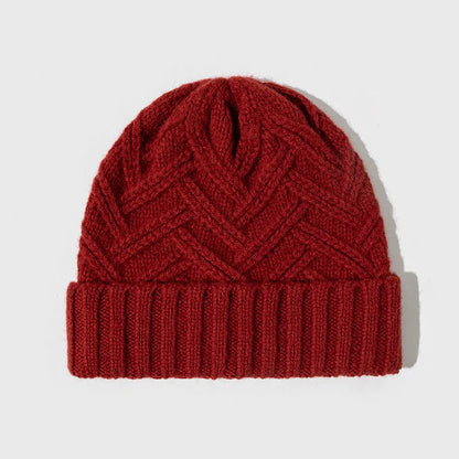 Wool knitted women's hat with dome crown in ankela red colour showing totem pattern details
