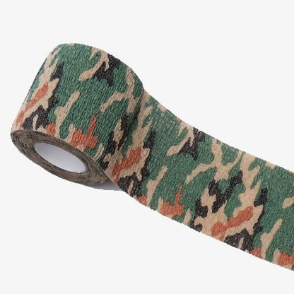Roll of non-woven elastic camouflage bandage tape in a forest pattern, 4.5 metres long and 5cm wide.