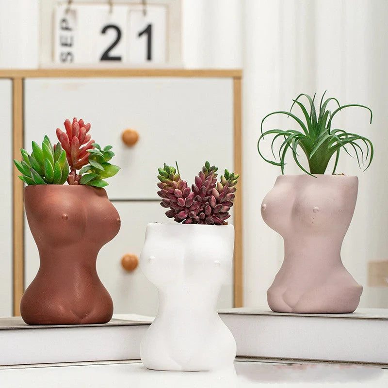 European-style ceramic flower pot ornaments with hand-painted figures and gods design, available in white, pink, and brown.