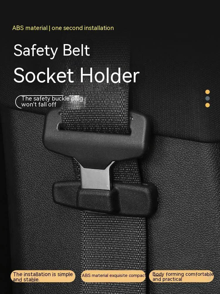 Two black ABS plastic car seat belt stopper clips on a clear OPP bag.