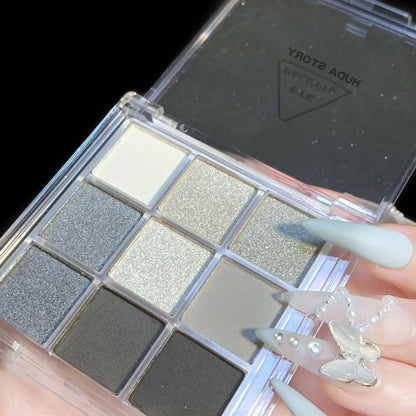 CZ0069 nine-colour smokey eyeshadow palette showing white, silver, black, and iron grey shades.