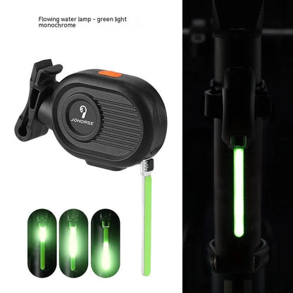 Bicycle rear safety light with a cascading waterfall LED light effect, mounted on a seat post.