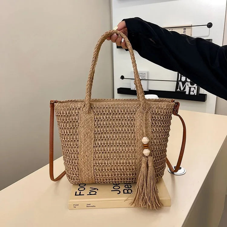 Women's large capacity straw crossbody bag in milky white or khaki with soft woven body and shoulder strap