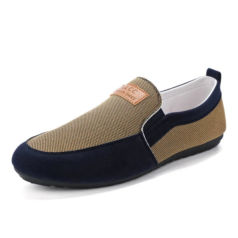 Men's grey canvas lace-up board shoes with round toe and rubber sole.