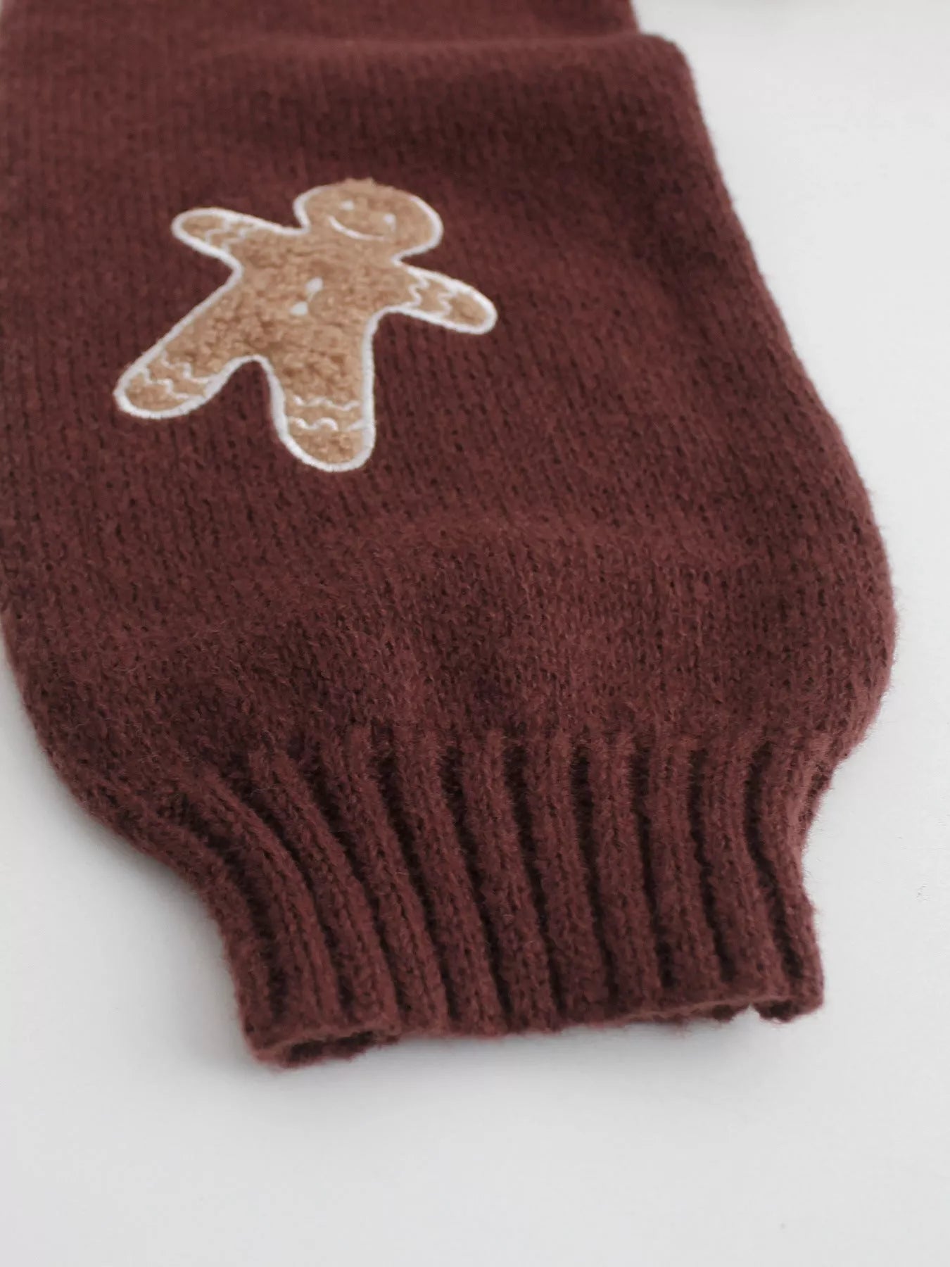 V-neck gingerbread man pattern knitted sweater in select colors