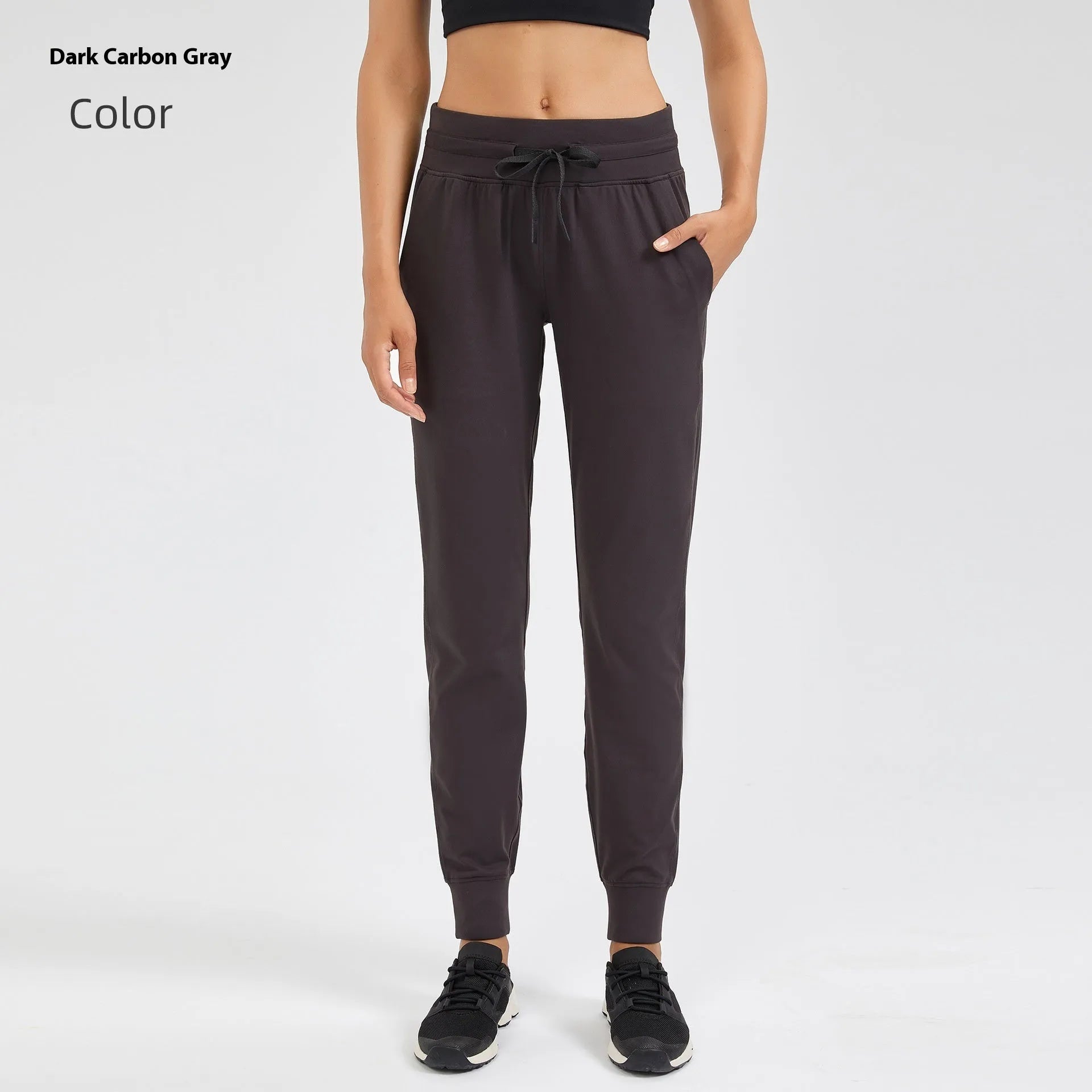 Women's high waist yoga pants with drawstring waistband in Belgian blue colour, showing stretch fabric during yoga pose