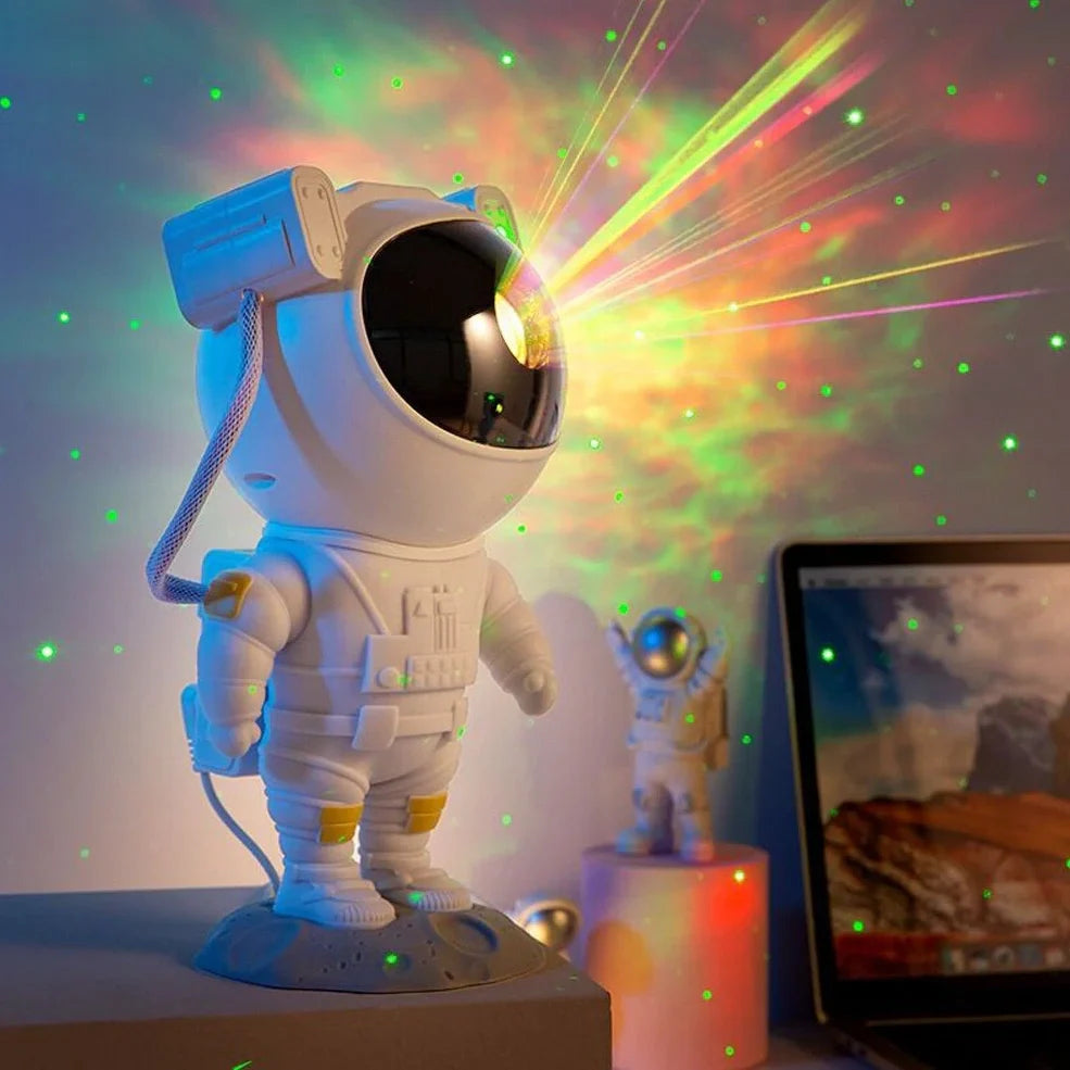 Astronaut-themed galaxy projector with adjustable nebula effects on table showing starry sky projection