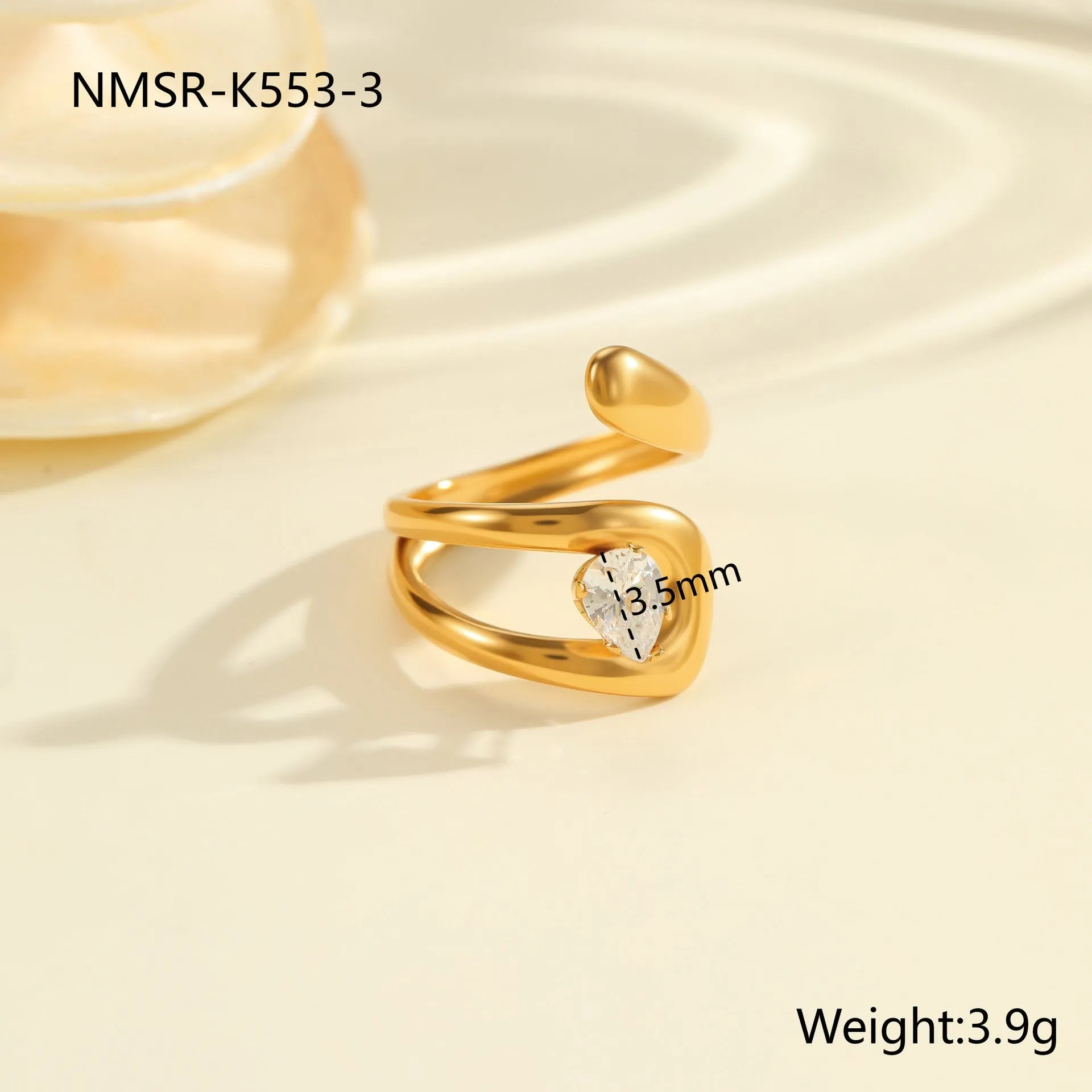 Geometric zircon ring showing round, oval and quadrangular design elements in stainless steel with electroplated finish