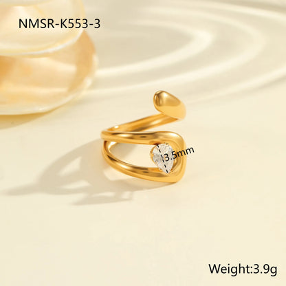 Geometric zircon ring showing round, oval and quadrangular design elements in stainless steel with electroplated finish