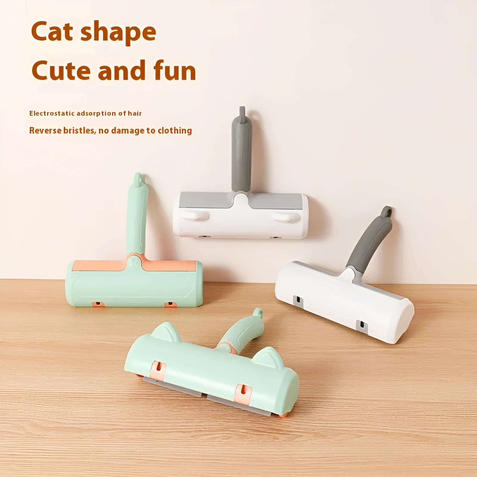 Mint green plastic cat hair removal brush with an ear-style handle on a fabric sofa.