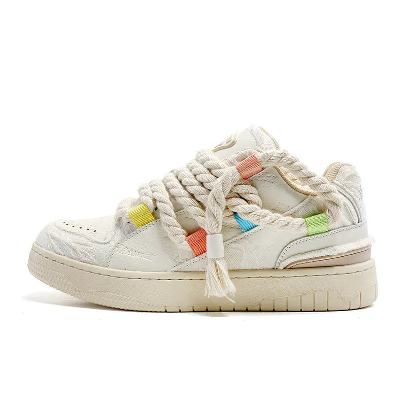 Creamy white old damage retro skate shoes with lace-up front, platform heel, and round toe.