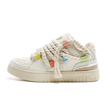 Creamy white old damage retro skate shoes with lace-up front, platform heel, and round toe.