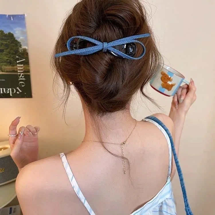 Handmade fabric bow hair grip with triangle grip design and plastic hairpin