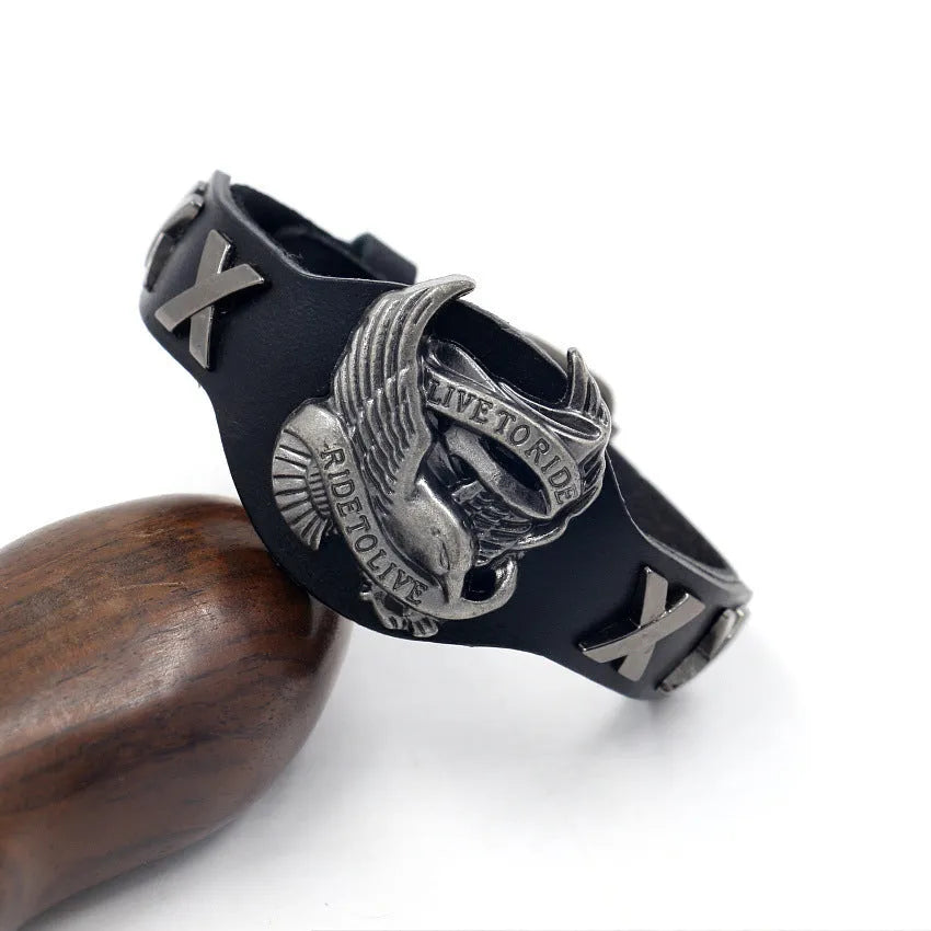 Black geometric leather bracelet with an alloy eagle watch-button style closure.