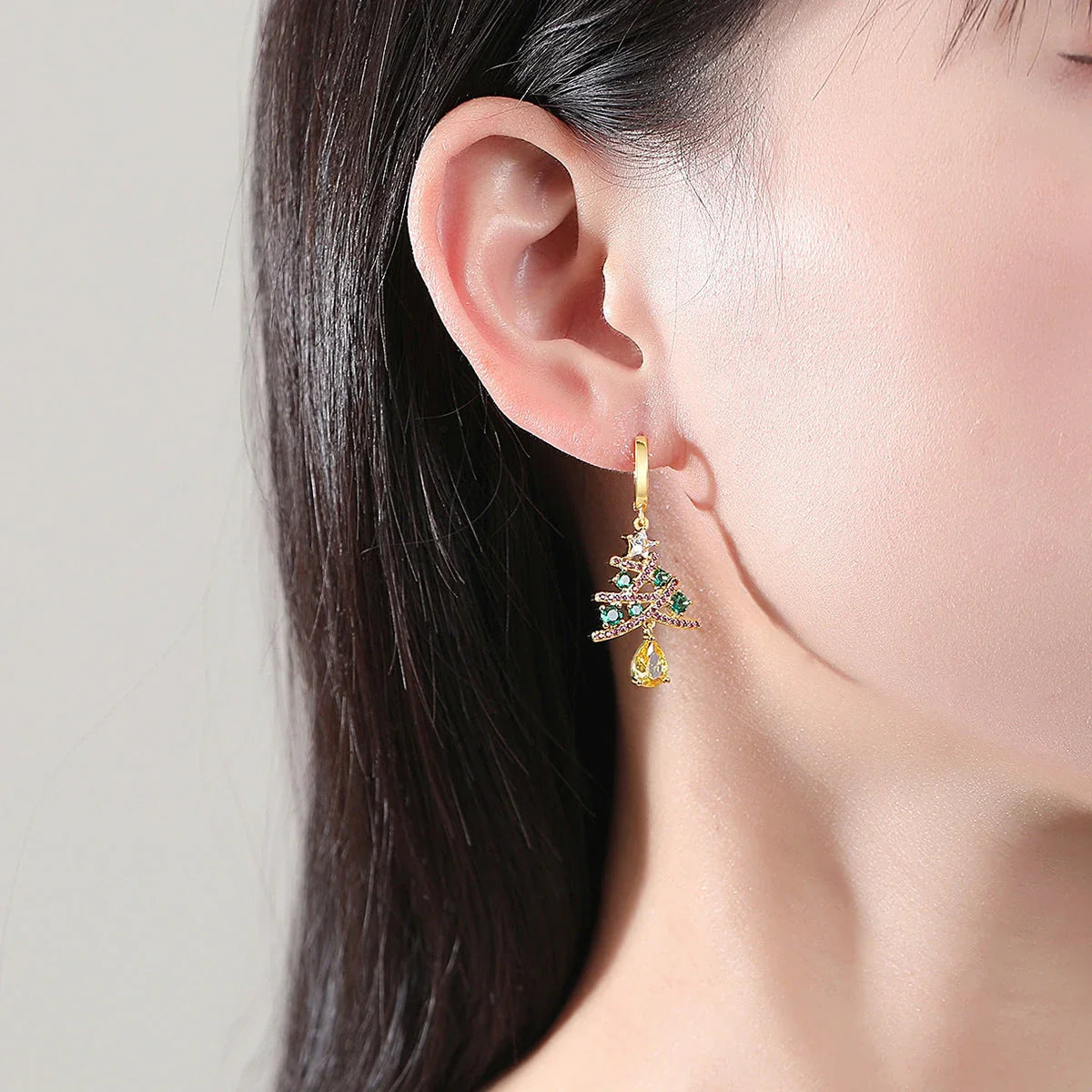 Elegant Christmas tree earrings with sparkling rhinestones, a festive holiday accessory for women