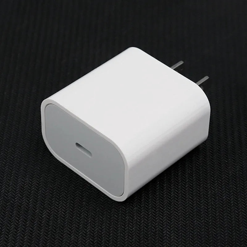 Mobile phone charger with USB interface showing American and European plug configurations