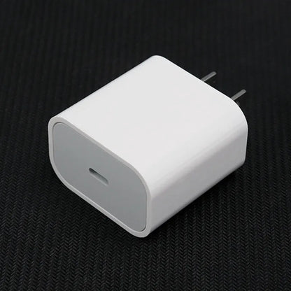 Mobile phone charger with USB interface showing American and European plug configurations