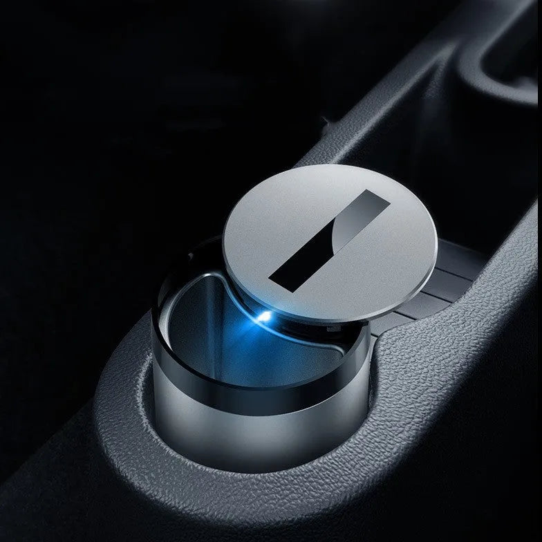 Automatic car ashtray in secret silver colour on a desktop, showing compact 7x10cm size.