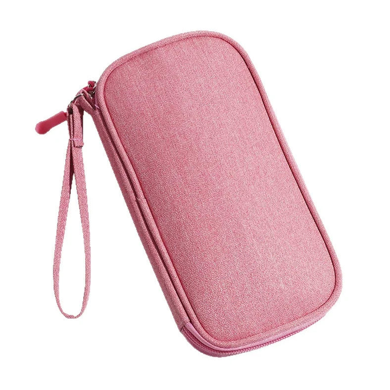 Light grey portable buggy bag for cable storage measuring 19x11x3cm with handbag-type shape