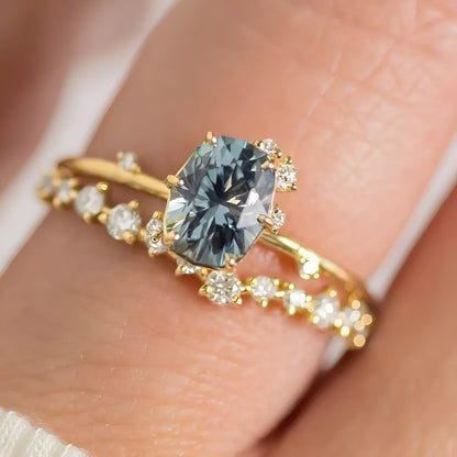 Gold-plated floral women's ring with a central green zircon stone on a model's hand.