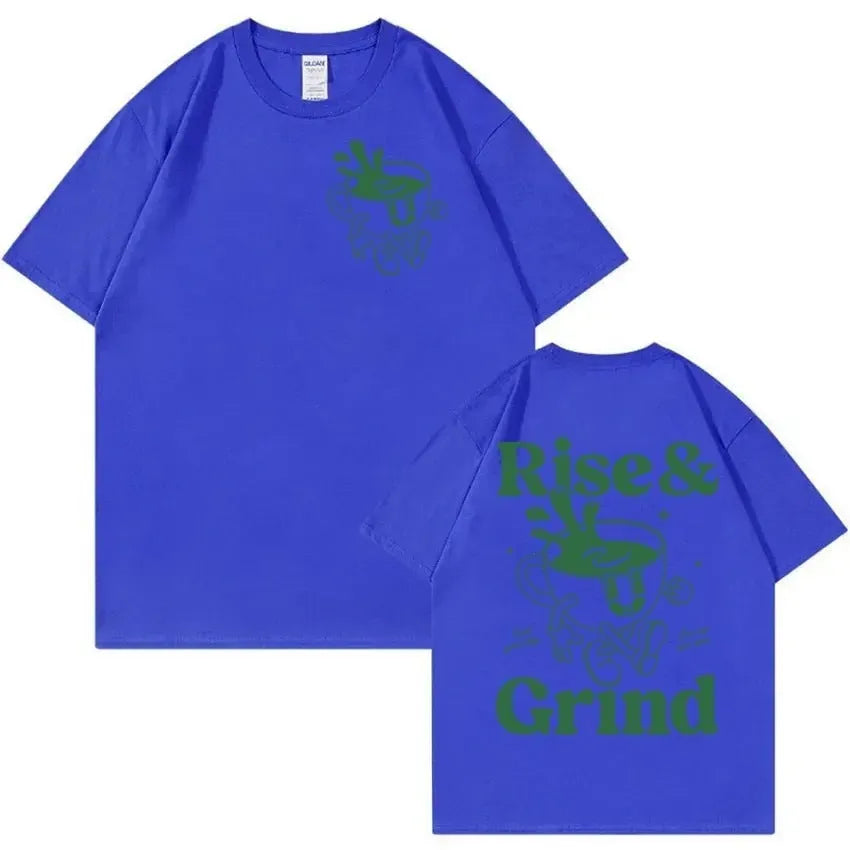 Man wearing a loose linen t-shirt with a printed Rise And Grind Green Coffee cartoon illustration.