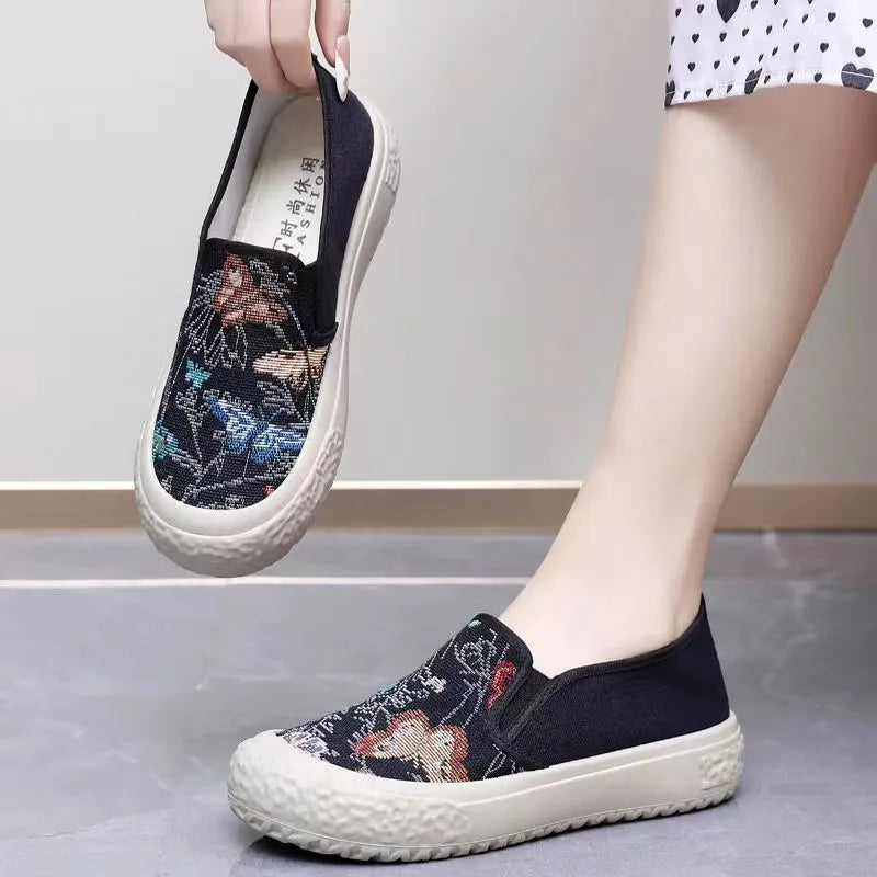 Women's classic canvas slip-on shoes with plastic soles in black and white colour options