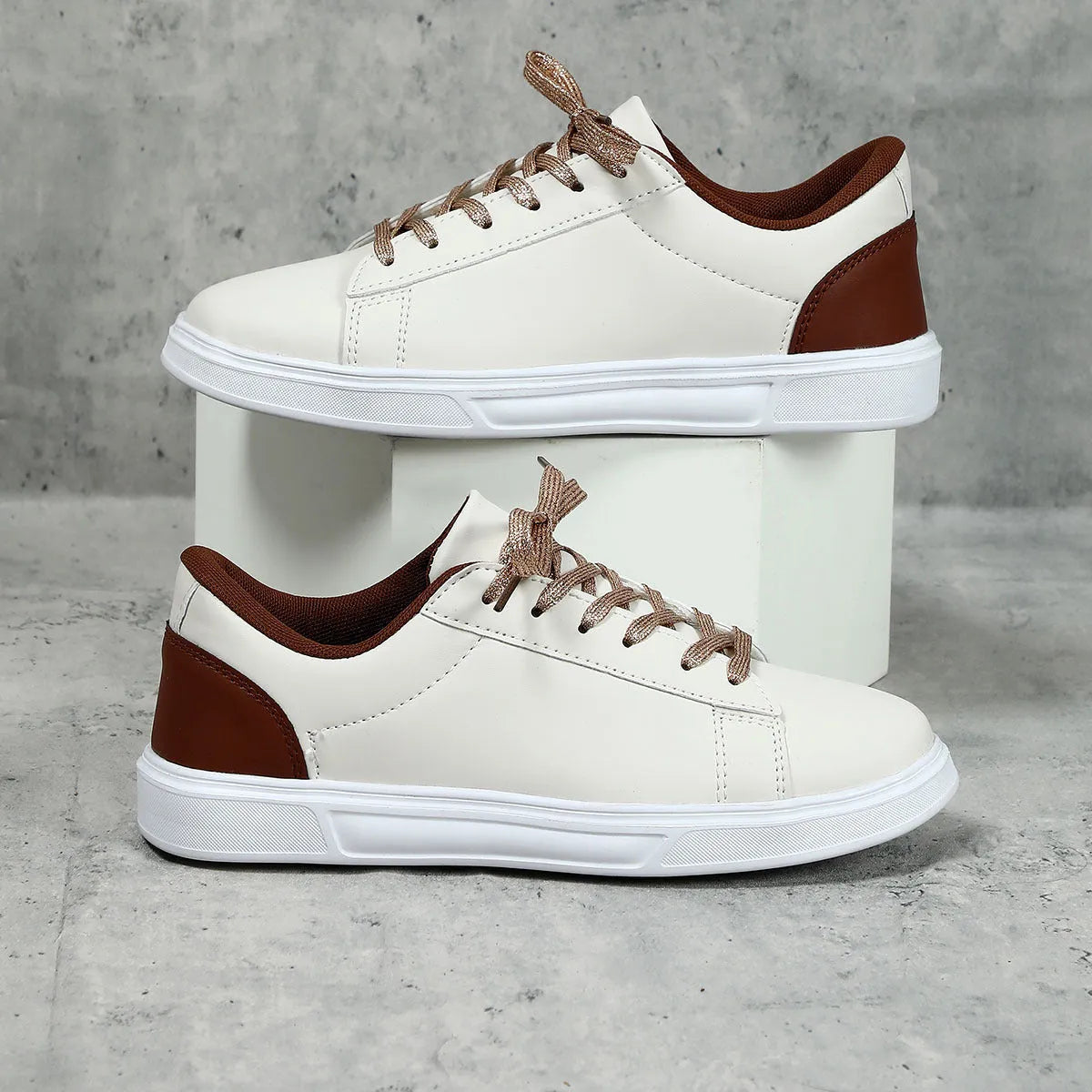 Beige brown women's low-top platform casual sneakers with a cross strap and round toe on a white background.