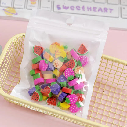 Assortment of 50 small cartoon erasers in pearlescent bags, showing fruit, animal, and holiday designs.