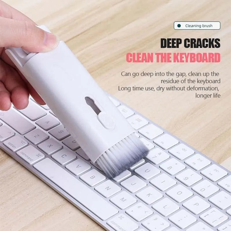 Multifunctional white cleaning pen kit open to show silicone tip, brush, keycap puller, and spray bottle for electronics.