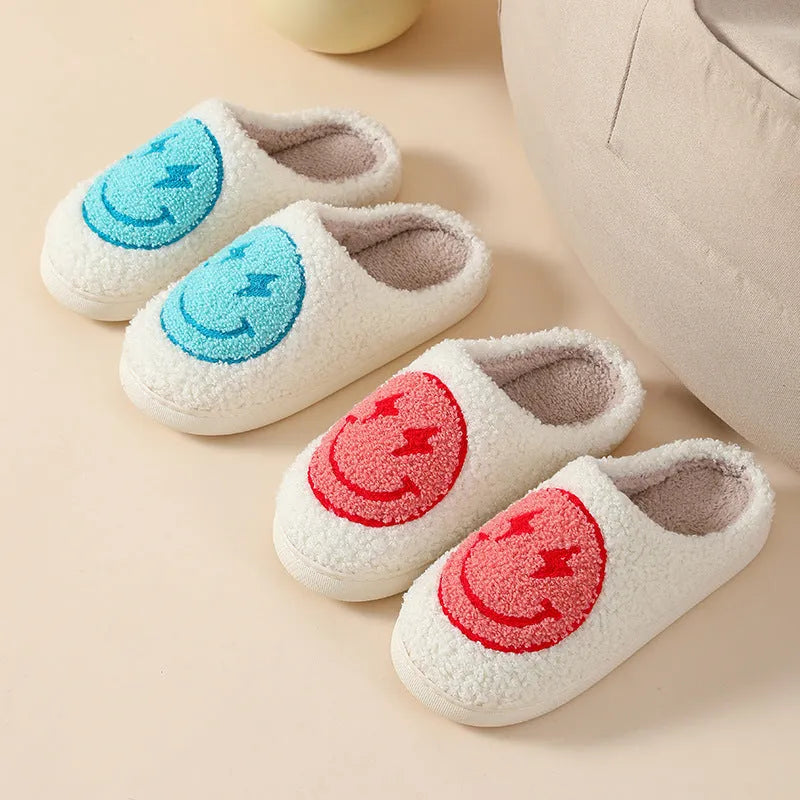 Women's plush home slippers with PVC non-slip sole in adult sizes 36-41, featuring cartoon designs including Big Love, mushroom, and blue smiley, for warm indoor footwear.