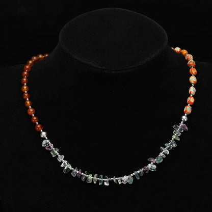 Hand-woven red agate round beads bracelet with geometric shapes and textured surfaces