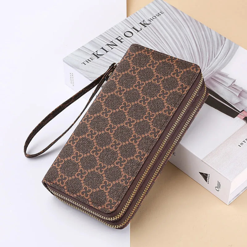 Long black retro-style PU leather wallet clutch with a printed pattern, showing a mobile phone pocket and a zippered coin purse.