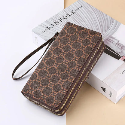 Long black retro-style PU leather wallet clutch with a printed pattern, showing a mobile phone pocket and a zippered coin purse.
