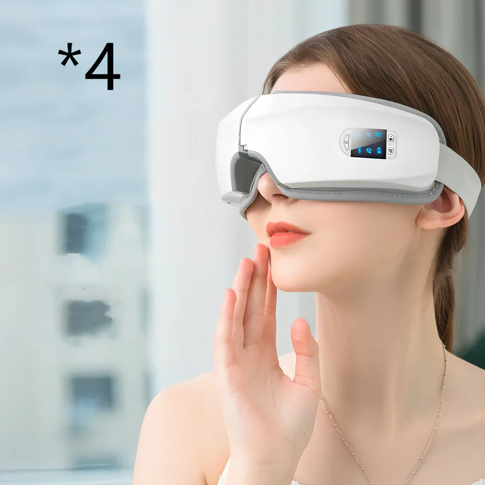White folding eye massager device with LCD screen, shown in open and closed positions