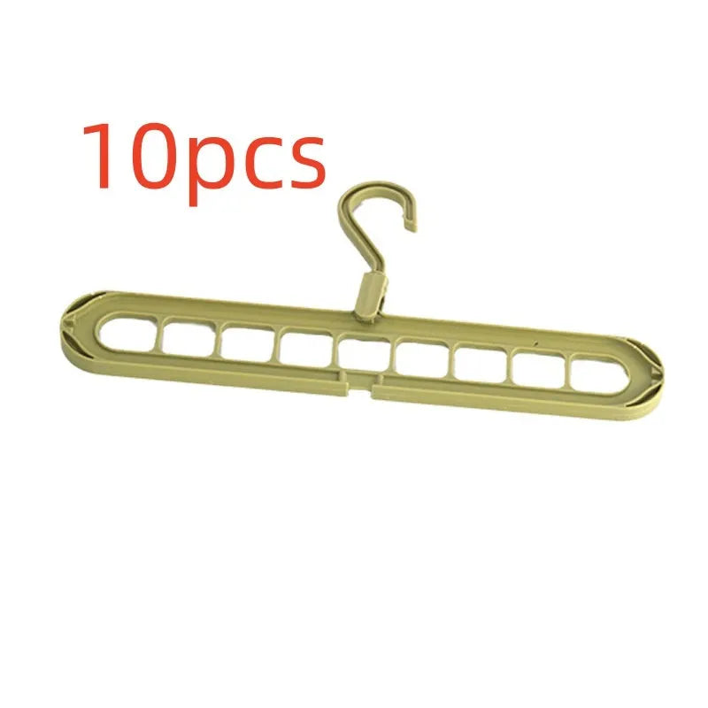 Green nine-hole folding hanger with trousers organised across nine hanging points, showing 45cm width