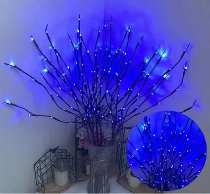 Silver branch LED tree light in a vase with multiple colour change modes including blue, pink, and warm white.