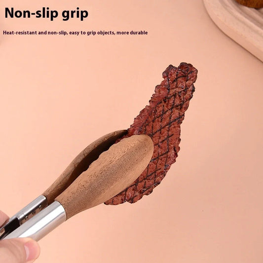 Stainless steel barbecue food tong with wood handle showing clamp mechanism and length measurement