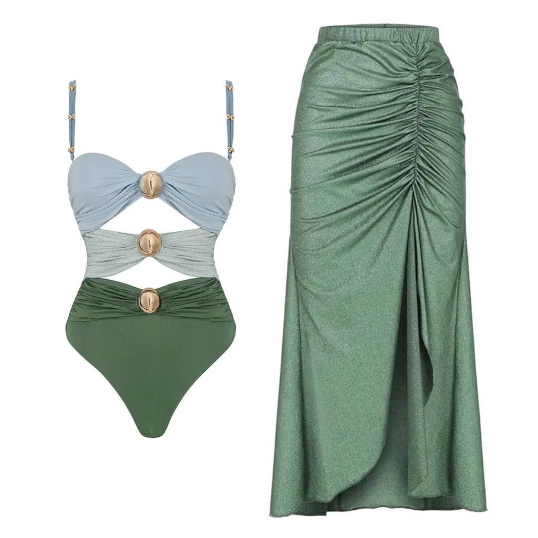 Women's green one-piece swimsuit with round buckle decoration and hollow-out stitching detail on nylon fabric.