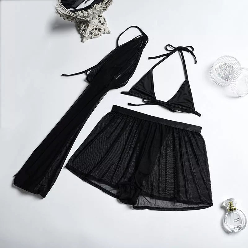 Solid black sling bikini set for women, includes bra, jacket, skirt, and shorts