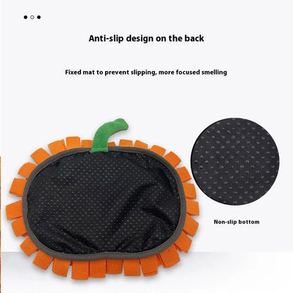 Orange pumpkin-shaped fleece pet slow feeder mat for dogs and cats on a wooden floor